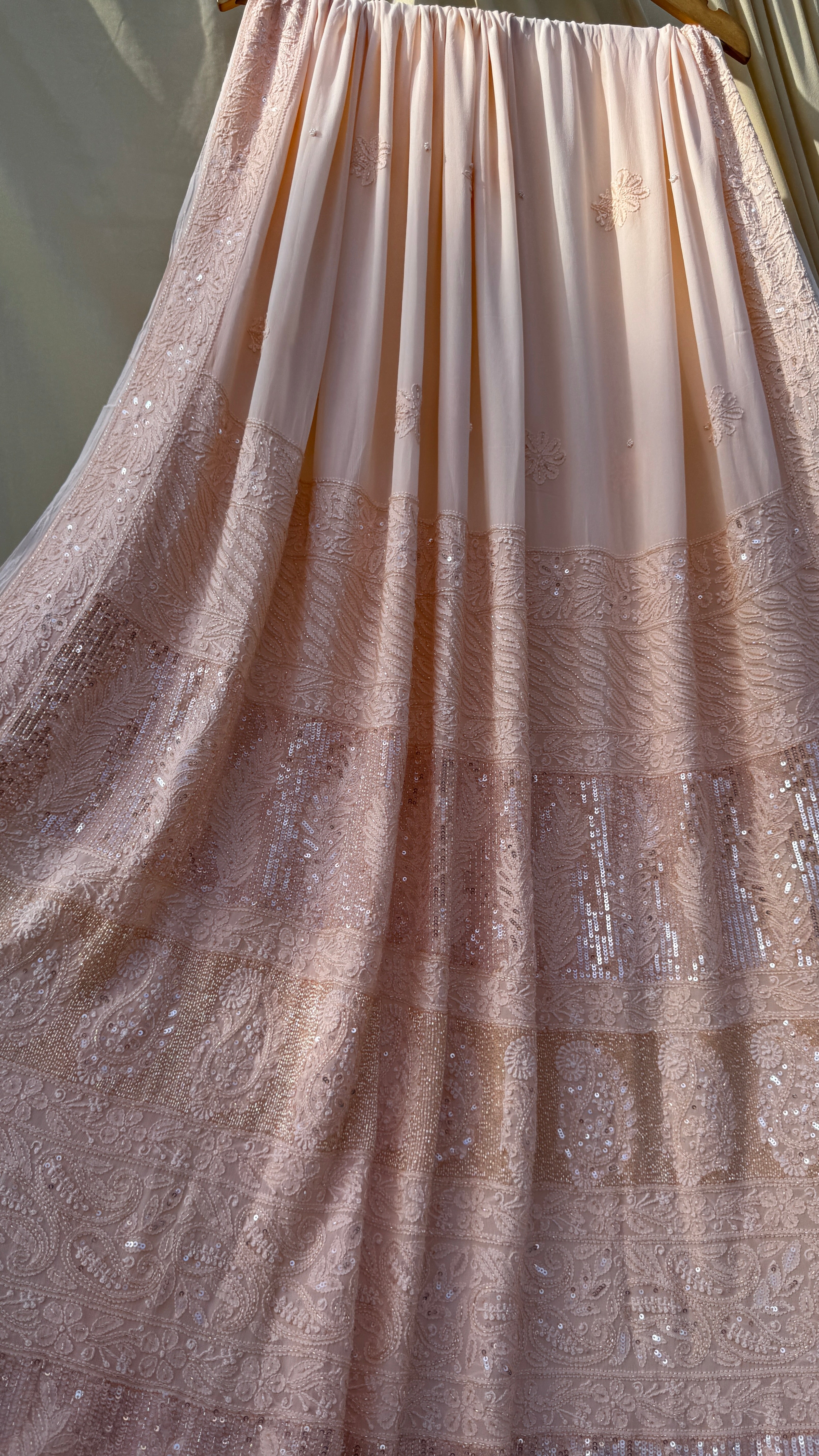 Viscose Peach Chikankari saree with Pearl embellishments