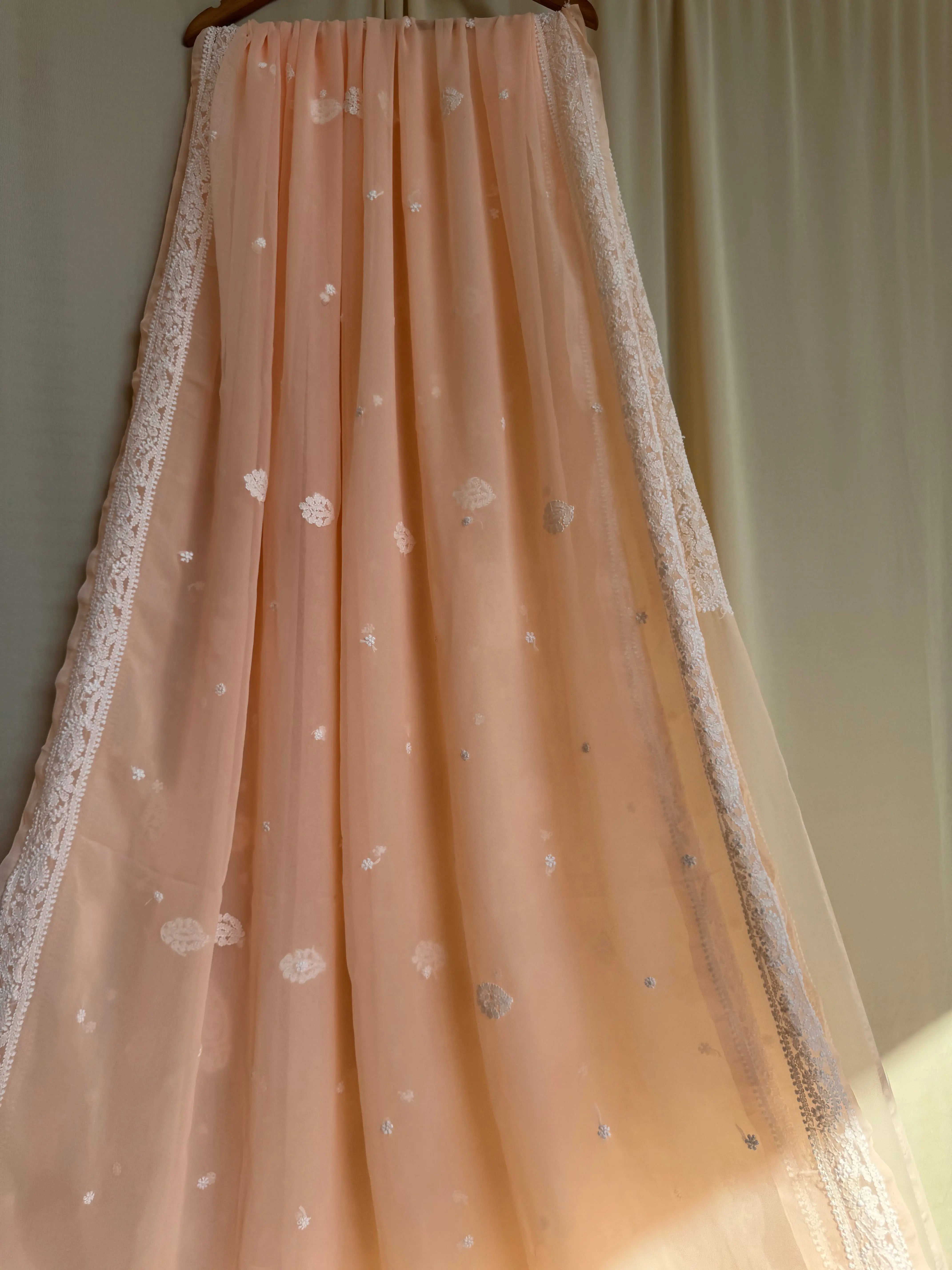 Georgette Chikankari saree in Peach ARIAA CHIKANKARI 